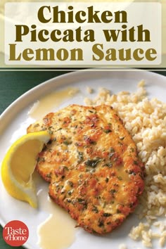 chicken piccata with lemon sauce on a white plate next to rice and lemon wedges