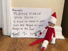 an elf is sitting next to a sign that says, please pick up your stuff i tried to come in your room and helped on your things on the floor