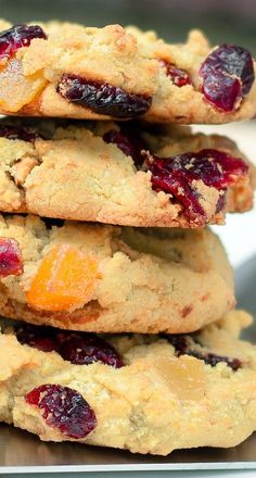 a stack of cookies with cranberries and oranges