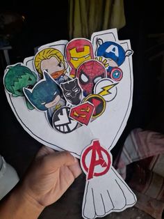 the avengers stickers are being held up