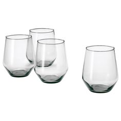 four wine glasses sitting next to each other