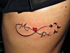 a woman's stomach with a tattoo that says mom and two birds on it