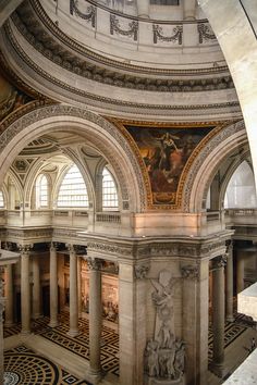 the interior of a building with marble floors and arches