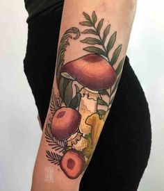 a woman with a mushroom tattoo on her arm