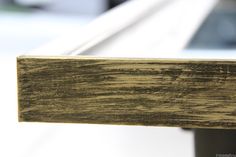 a close up view of the wood on a window sill that has been stained white