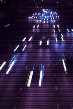 cars driving down a highway at night time