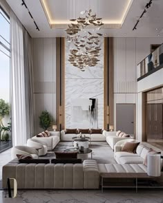 a large living room with white couches and chandelier hanging from the ceiling