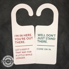 two door hangers that say i'm in here, you're out there