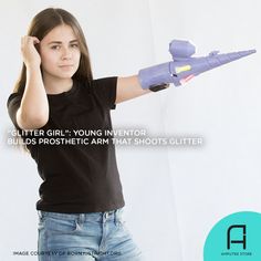 a young woman is holding her arm in the air with an object on it's back