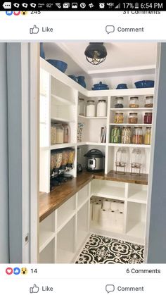 an open pantry with lots of white cabinets