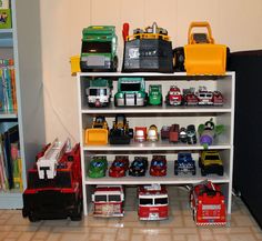 a shelf filled with lots of toy cars and trucks