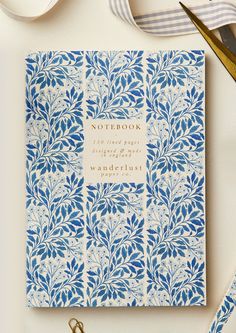 a notebook with blue and white designs on it