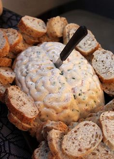 a plate filled with bread and some kind of white substance on top of it's surface