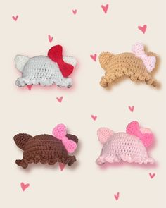 four crocheted dogs laying on top of each other with hearts in the background