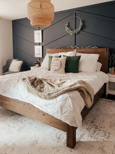 a bed with white sheets and pillows in a room