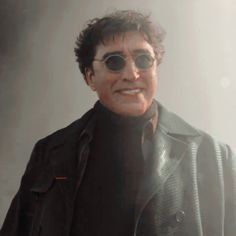 a man wearing sunglasses and a black jacket