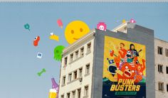 an advertisement on the side of a building for pink busters is flying in the air