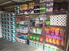 the shelves are full of toilet paper and other items for sale at the store's convenience section