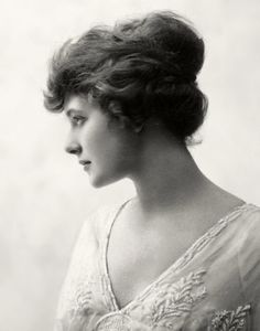 an old black and white photo of a woman