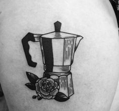 a tattoo on the back of a woman's thigh with a coffee pot and rose