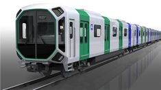 a green and white train traveling down tracks next to a loading platform with doors open