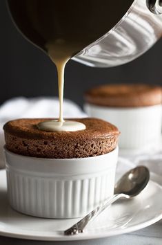 chocolate cake with white icing being drizzled on top