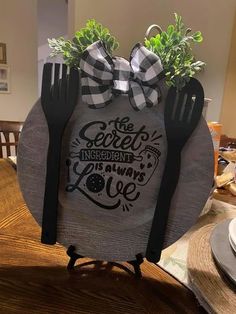 the fork and knife holder is decorated with black and white bowknots on it