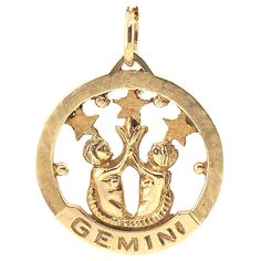 Attractive cut-out charm with the twin "Gemini" motif. The Gemini twins are facing each other and holding up three stars. 14K yellow gold. An interesting mixture of shiny gold and textured gold finishes. 1" in diameter. Alice Kwartler has sold the finest antique gold and diamond jewelry and silver for over forty years. Celestial Yellow Gold Charms As Gifts, Symbolic Engraved Yellow Gold Charms, Symbolic 14k Yellow Gold Charms, 14k Yellow Gold Symbolic Charms, Symbolic Yellow Gold Charms With Round Pendant, Symbolic Yellow Gold Round Pendant Charms, Symbolic Yellow Gold-plated Charms, Gemini Jewelry, Gemini Twins