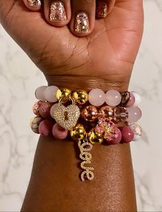 PLEASE MEASURE YOUR WRIST BEFORE ORDERING 🙏🏾  Authentic 10mm Love Goddess Bracelet Stack Made With Rose Quartz, Rhodonite, Howlite and White Agate Gemstones Rose Quartz: Unconditional Love, Peace, Emotional Healing (Heart Chakra) Rhodonite: Emotional Grounding, Forgiveness, Compassion  (Heart/ Root Chakra) Howlite: Tranquillity, Release Trauma, Connect To Higher Consciousness (Crown Chakra) White Agate: Balance, Release, Enlightenment (Crown Chakra) ⭐️These bracelets are made-to-order. Sizes are actual wrist circumference, not the length of the bracelet. So, please MEASURE YOUR WRIST and order that size from drop down menu. (Available sizes in inches: 6", 6.5", 7", 7.5") ⭐️Processing time is 3-5 business days. We'll ship them out as soon as your order is made, and you'll be notified once Love Goddess, Goddess Bracelet, Healing Heart, Higher Consciousness, White Agate, Root Chakra, Crown Chakra, Quartz Rose, Emotional Healing