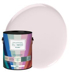 a paint can and a white plate on a white background