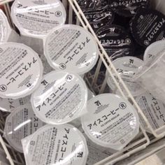 many black and white plates are in a basket