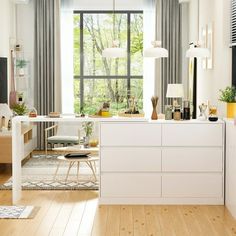 a living room filled with furniture next to a large window covered in lots of windows