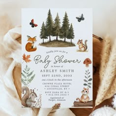 a baby shower with woodland animals and trees