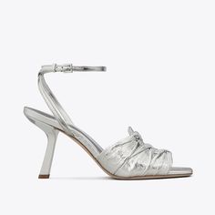 A ruched upper adds a vintage sensibility to a heeled sandal. Made with crinkled metallic leather and finished with a buckled ankle strap.Crafted in partnership with a Leather Working Group-certified tannery, supporting high standards in leather manufacturing and chemical management.