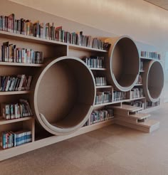 the bookshelves are lined up against the bookcases in the library area