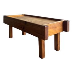 a wooden table with two legs that are attached to the top and one leg is extended