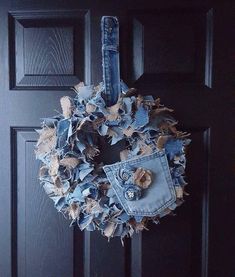 an old pair of jeans hanging on the front door with a hole in it's pocket