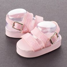 Tallina's Pink Platform Sandal Doll Shoes. Complete your doll's ensemble with this pair of must-have Tallina's Pink Platform Sandal Doll Shoes!    Every outfit needs the perfect pair of shoes. With these fashionable baby doll shoes, you can make sure your doll steps up their style for any occasion. Perfect for doll making, baby shower favors, and more.    What size shoes will fit my doll?  Just like people, dolls have different sized feet. Using a cloth measuring tape with millimeter increments, measure for the length of your doll's foot from heel to toe then measure the at the widest point for the width. You can also trace the doll's foot on a sheet of blank paper to measure the length and width. If measuring bare feet, add an additional 5 millimeters to the length to ensure a correct fit Baby Shoe Crochet, Kids Shoes Girls, Shoe Crochet, Shoes For Baby Girl, Pink Kid Heels, Cute Doll Shoes, Perfectly Cute Baby Doll Accessories, Pink Platform Sandals, Shoes For Babies