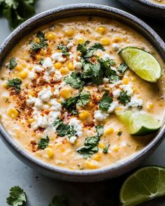 a bowl filled with corn, cheese and cilantro