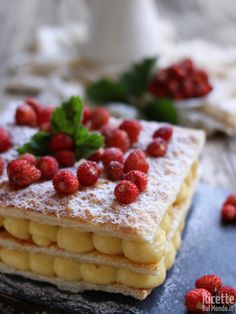 a dessert with raspberries and powdered sugar