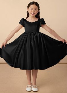 Juno is our sweet and classy matte satin dress. She features adorable puff sleeves, a sweetheart neckline, a A-line skirt, and a beautiful bow at the back of the dress. Young Bridesmaid Dresses, Satin Flower Girl Dresses, Black Graduation Dress, Black Flower Girl, Black Flower Girl Dress, Baby Fancy Dress, Dresses In Black, Satin Flower Girl Dress, Kids Formal