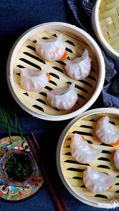 three bowls filled with dumplings on top of a table