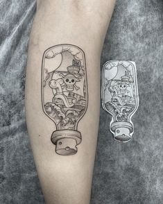 a tattoo on the leg of a person with a bottle in front of it and an image of a skeleton inside