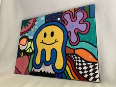 a colorful painting with an octopus on it's face and some other things in the background