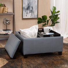 a living room with a coffee table and ottoman