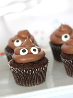 three chocolate cupcakes with googly eyes on them