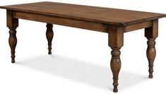 an old style wooden table with turned legs