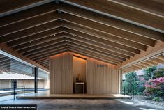 the inside of a building with wooden walls