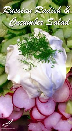 a pile of sliced radish and cucumber salad with sour cream on top