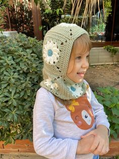 Crochet kids balaclava's are the perfect way to stay warm and stylish during the winter months. These unique, handmade accessories are made from soft yarn and can be worn in a variety of ways, from covering the head and neck to covering the entire face. ❤️❤️ The Crochet Grannysquare Balaclava is a great option for those who want a more traditional, cozy look. The granny square pattern adds a touch of nostalgia while the yarn material keeps you warm and protected from the wind and cold. ❤️❤️ Knitted Balaclava for Women are great for ladies who want a comfortable and fashionable way to stay warm. These balaclava's come in different designs and styles and are perfect for everyday wear. They are also a great option for outdoor activities such as skiing, snowboarding, and hiking. ❤️❤️ The Grann Toddler Balaclava Knit Pattern, Crochet Balaclava Baby, Crochet Winter Hat, Crochet Balaclava, Crochet Winter Hats, Knitted Balaclava, Cozy Accessories, Crochet Winter, Baby Bonnet